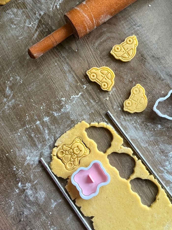 headline Joyful cookie making using playful animal and vehicle cutters in Egypt.